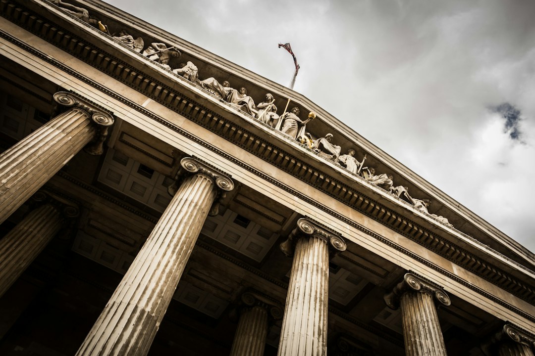 Columns of a courthouse building seen from below